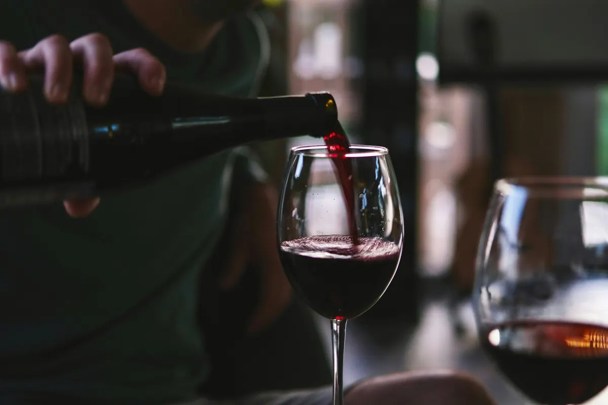 Red wine being poured into a glass