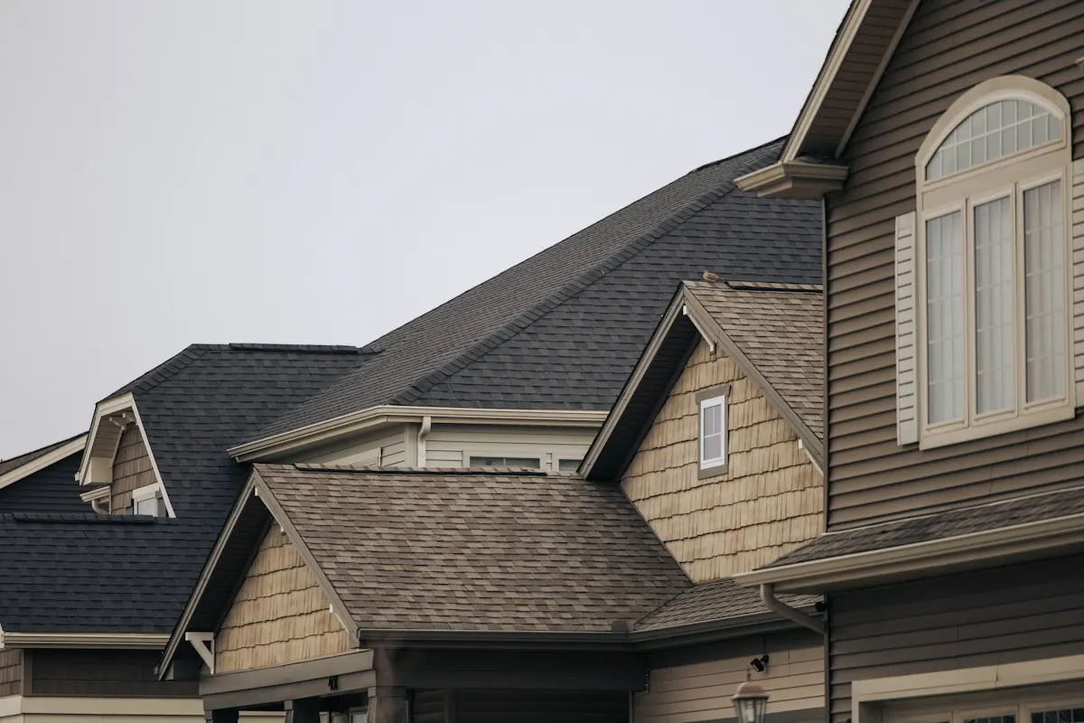 A two-storey home with new charcoal architectural shingles